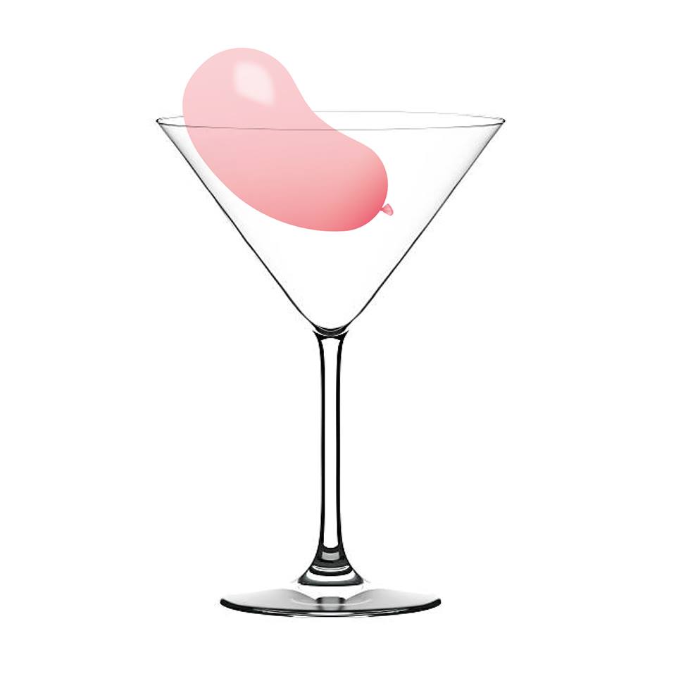 Cocktailglas mit rosa Luftballon